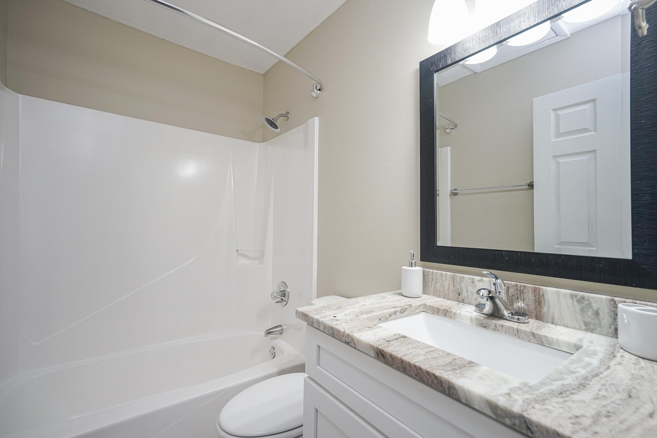 16 Court Drive Destin, FL 32541 - Photo 25 of 50 a bathroom with a granite countertop sink toilet and shower