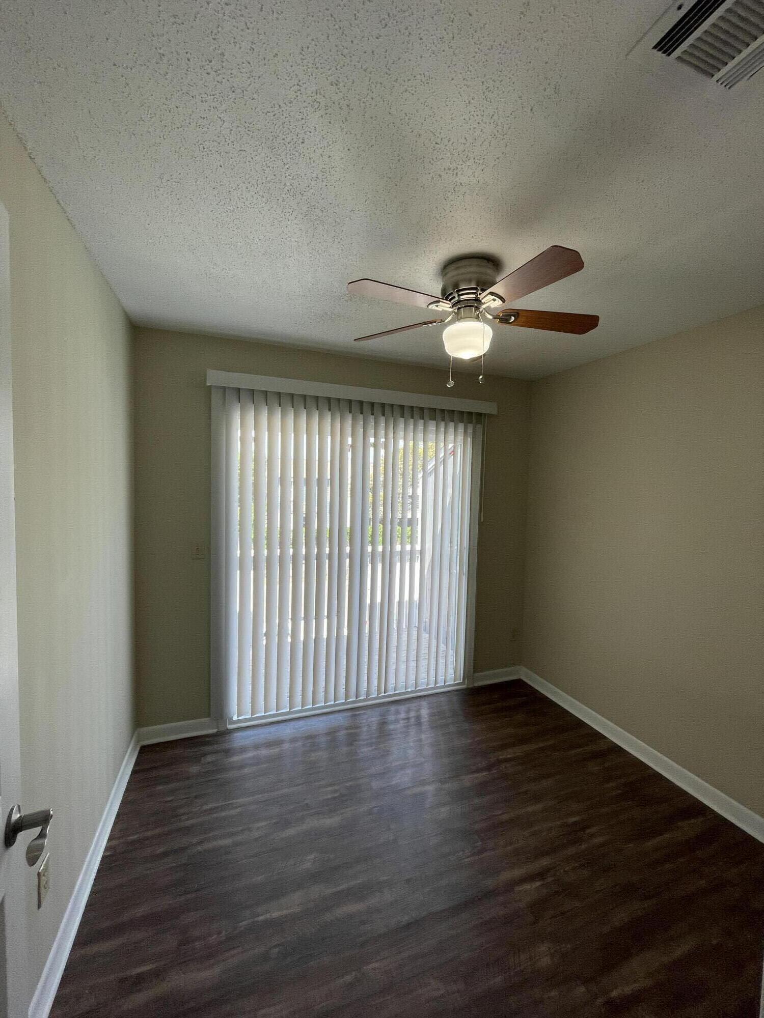 16 Court Drive Destin, FL 32541 - Photo 29 of 50 wooden floor in an empty room with a window