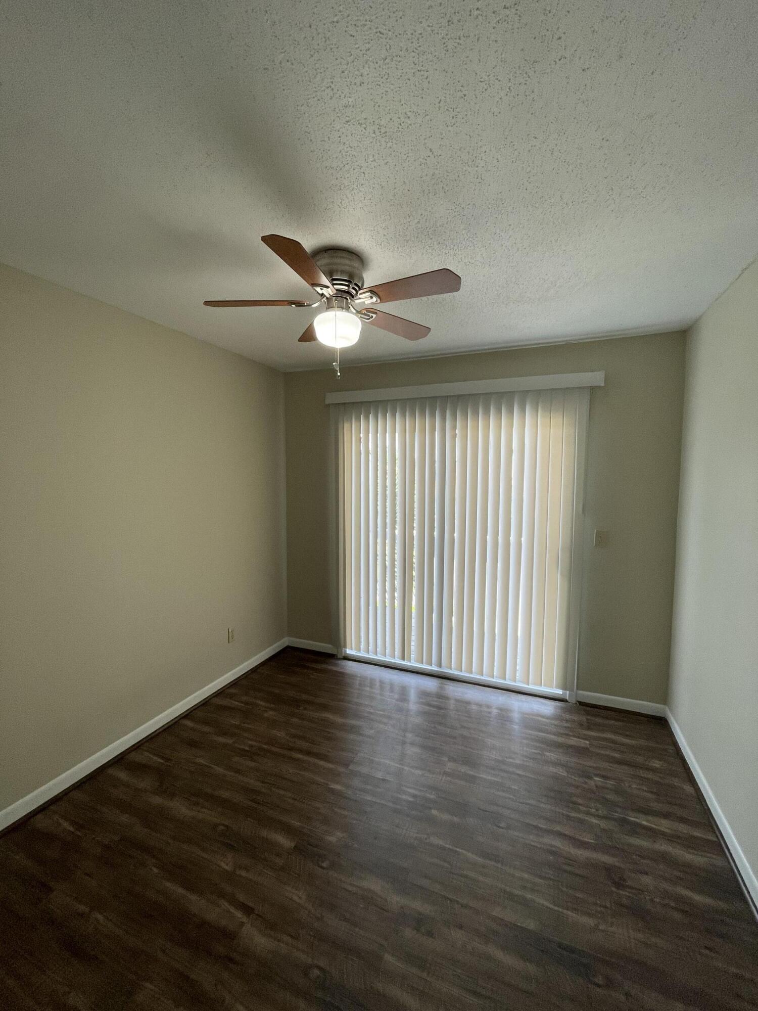 16 Court Drive Destin, FL 32541 - Photo 30 of 50 a view of an empty room with wooden floor and a window