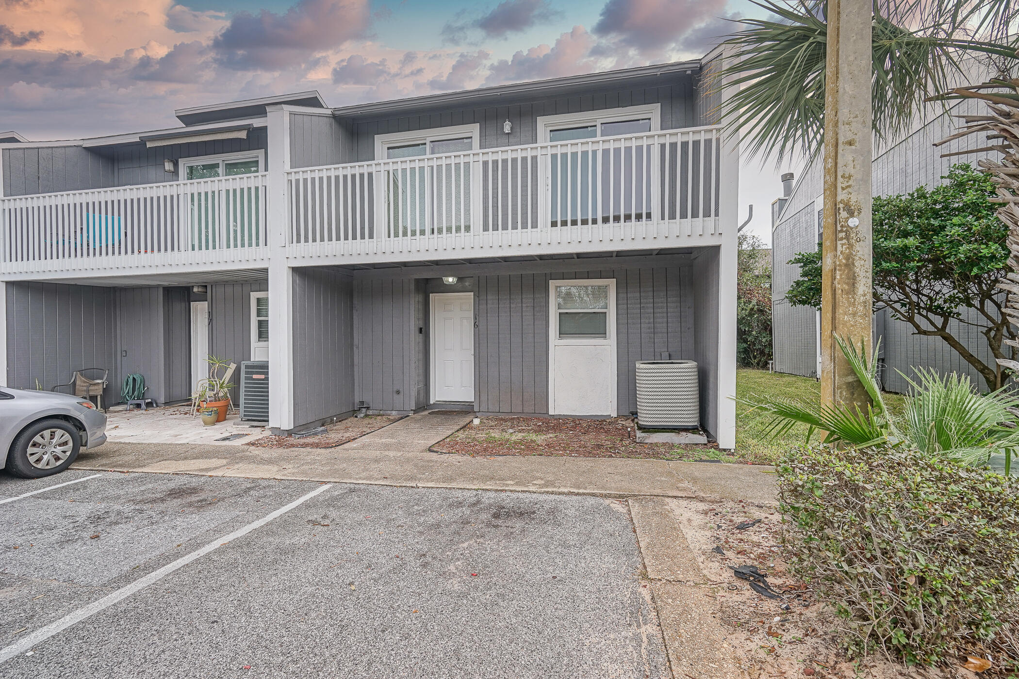 16 Court Drive Destin, FL 32541 - Photo 39 of 50 a front view of a house with parking area