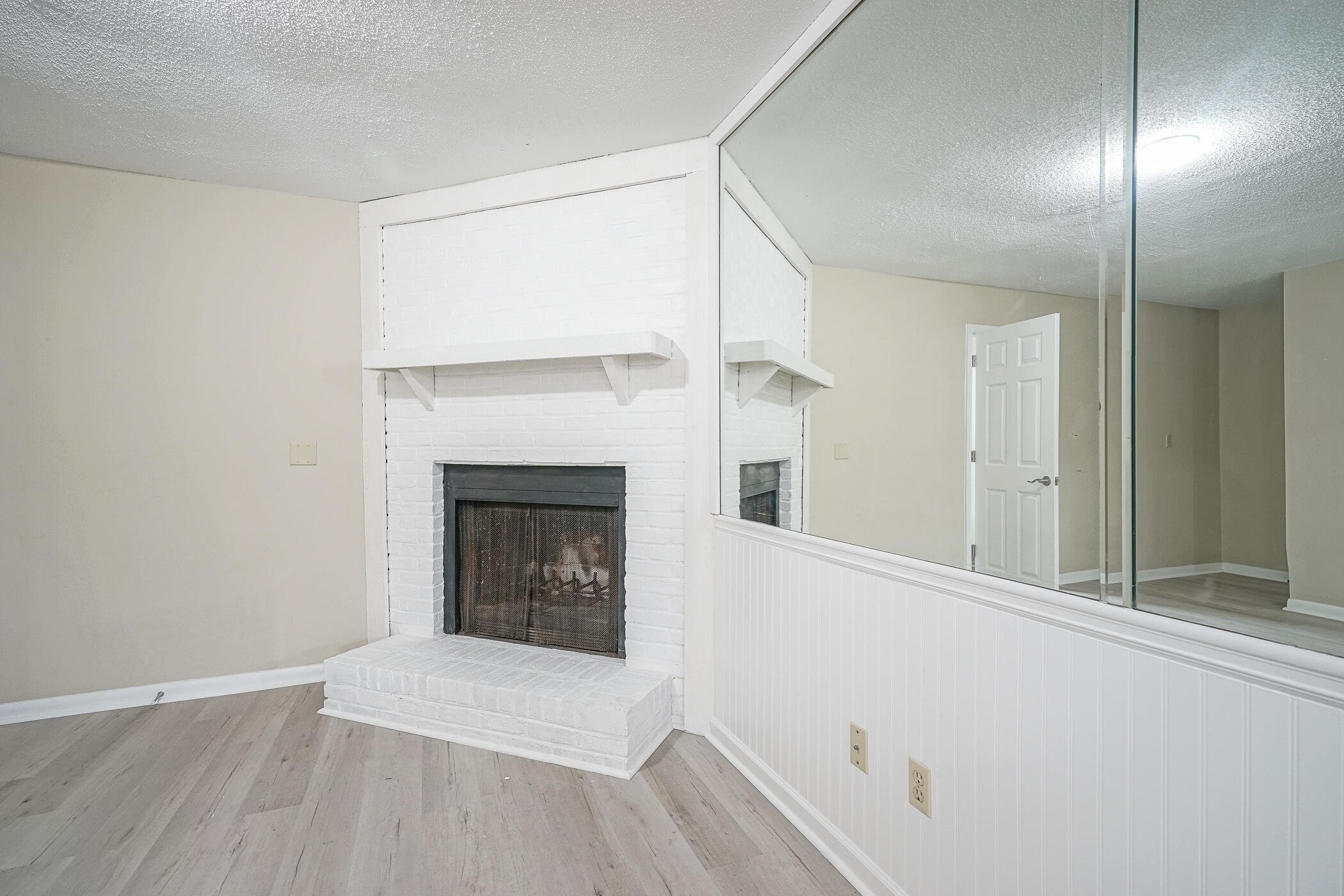 16 Court Drive Destin, FL 32541 - Photo 10 of 50 a view of an empty room with wooden floor and a window