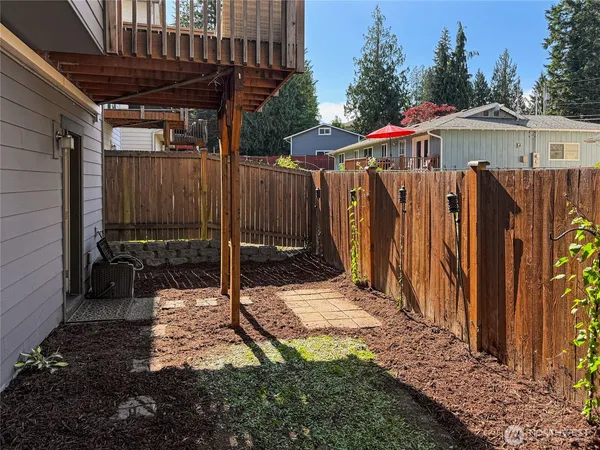 a view of a backyard with under an umbrella