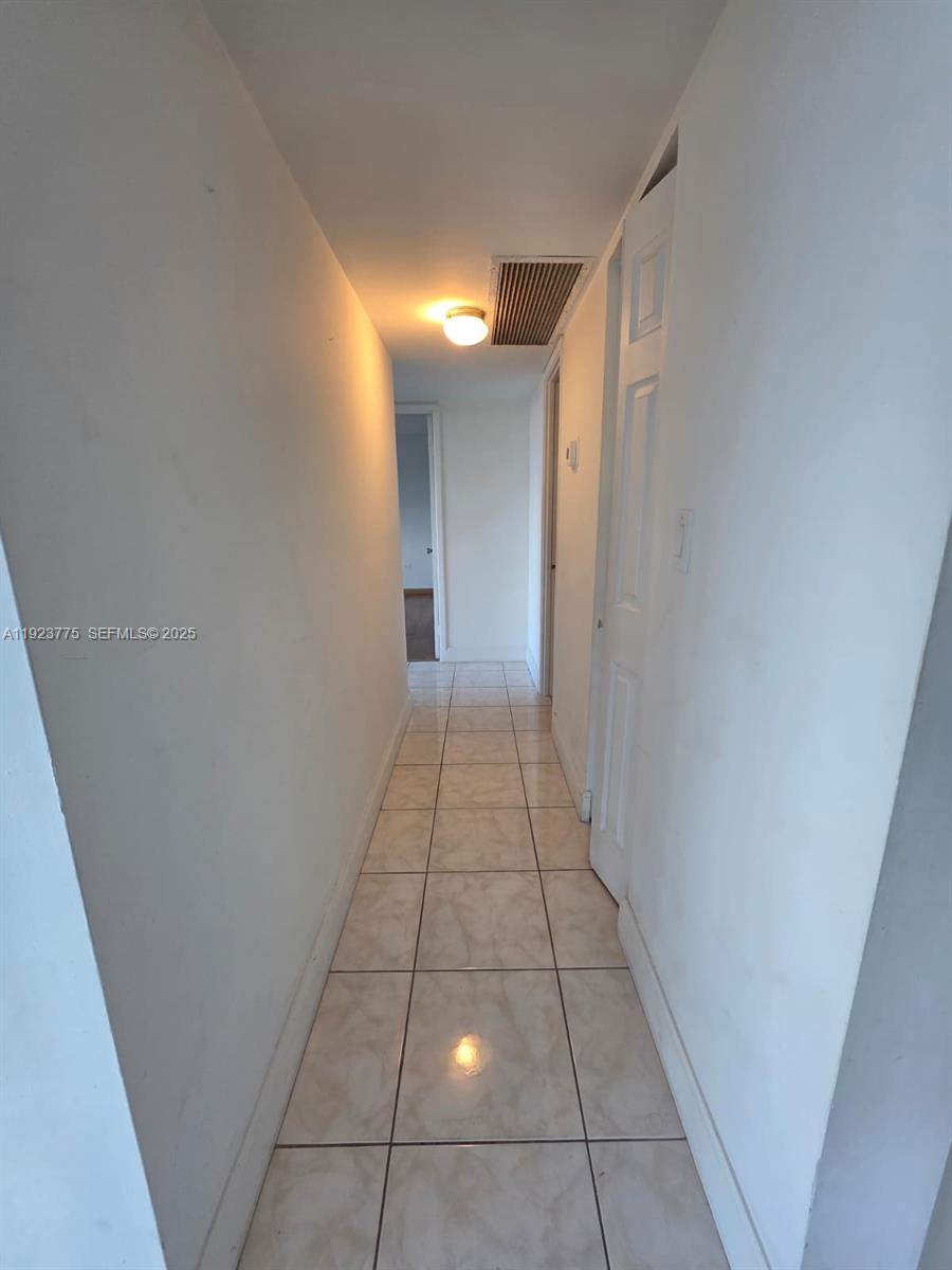 7135 Collins Avenue, Unit 725 Miami Beach, FL 33141 - Photo 15 of 21 a view of a hallway