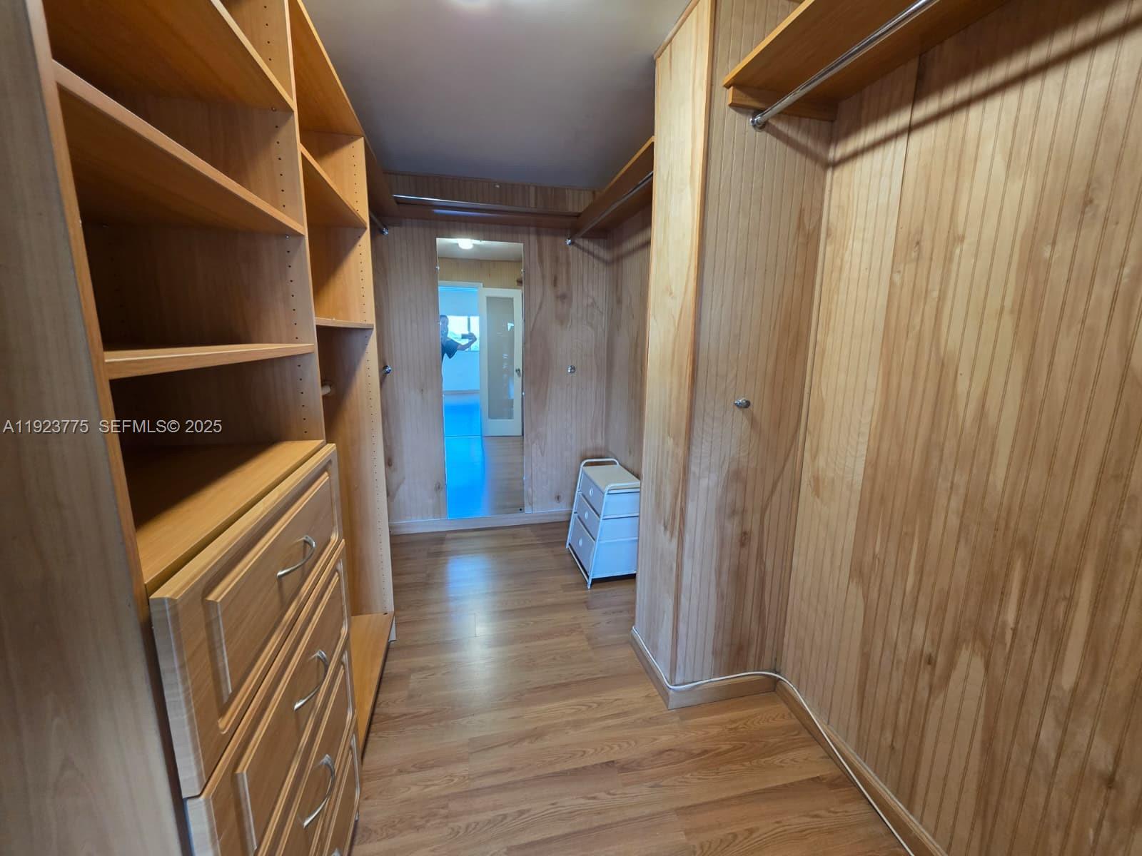7135 Collins Avenue, Unit 725 Miami Beach, FL 33141 - Photo 16 of 21 a view of a hallway with wooden floor and staircase