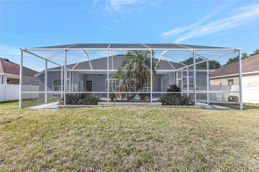 2863 Duncan Tree Circle Valrico, FL 33594 - Photo 6 of 53 a view of a house with backyard and sitting area