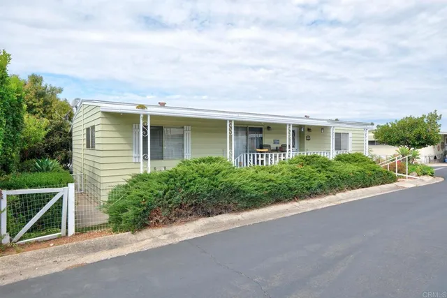 a view of a house with a street