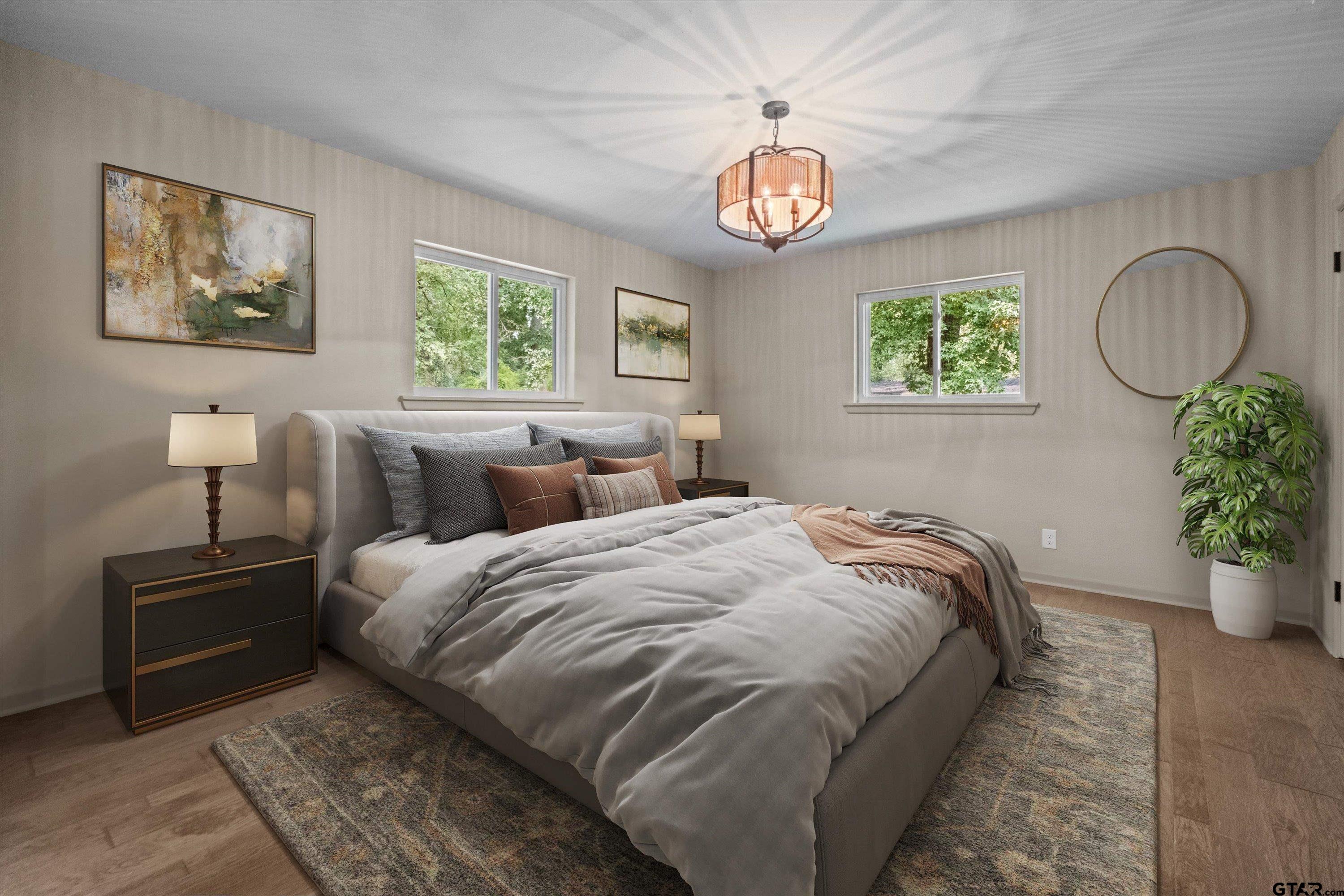 2515 Preston Avenue Tyler, TX 75701 - Photo 12 of 27 a bed sitting in a bedroom next to a window