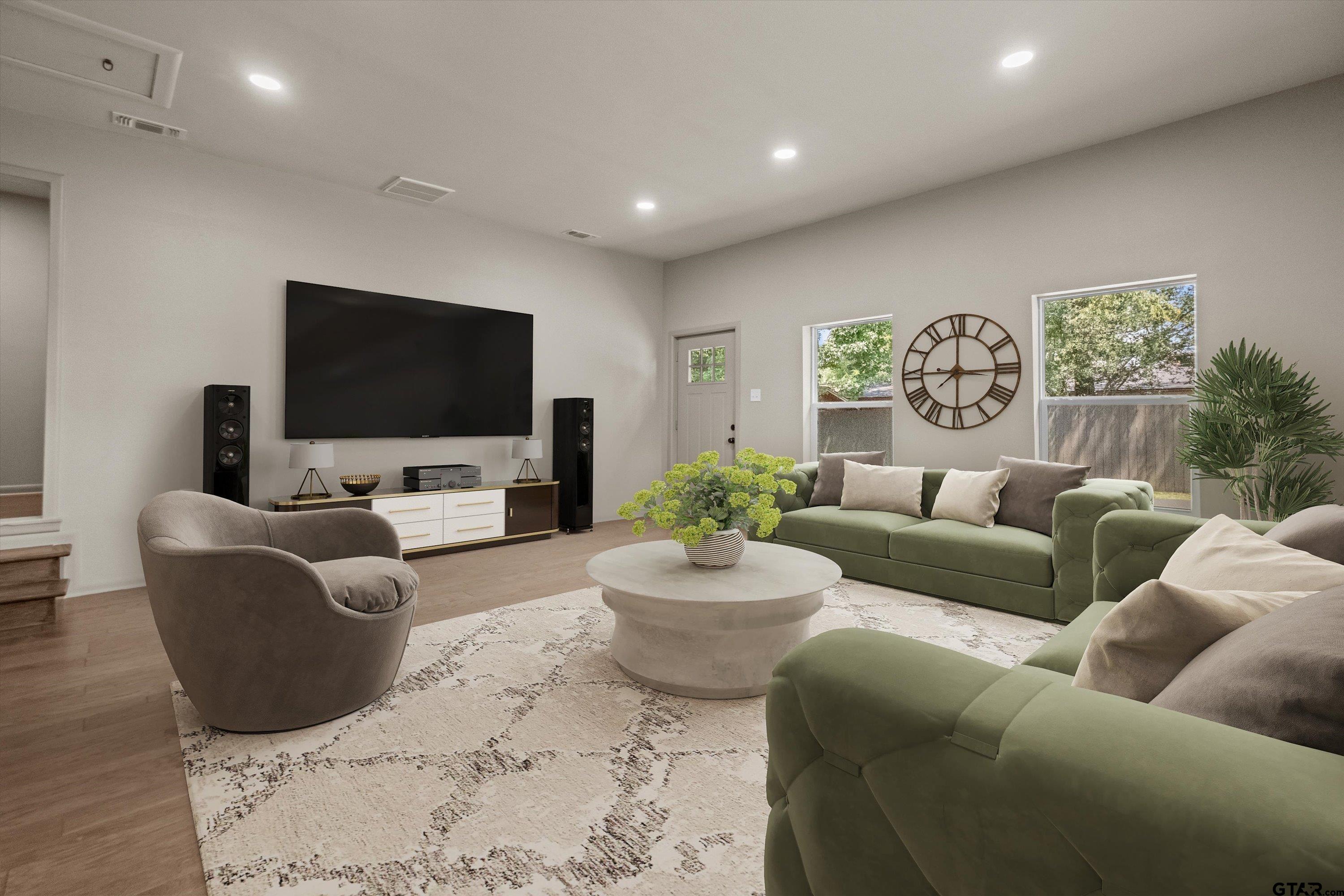 2515 Preston Avenue Tyler, TX 75701 - Photo 16 of 27 a living room with furniture and a flat screen tv