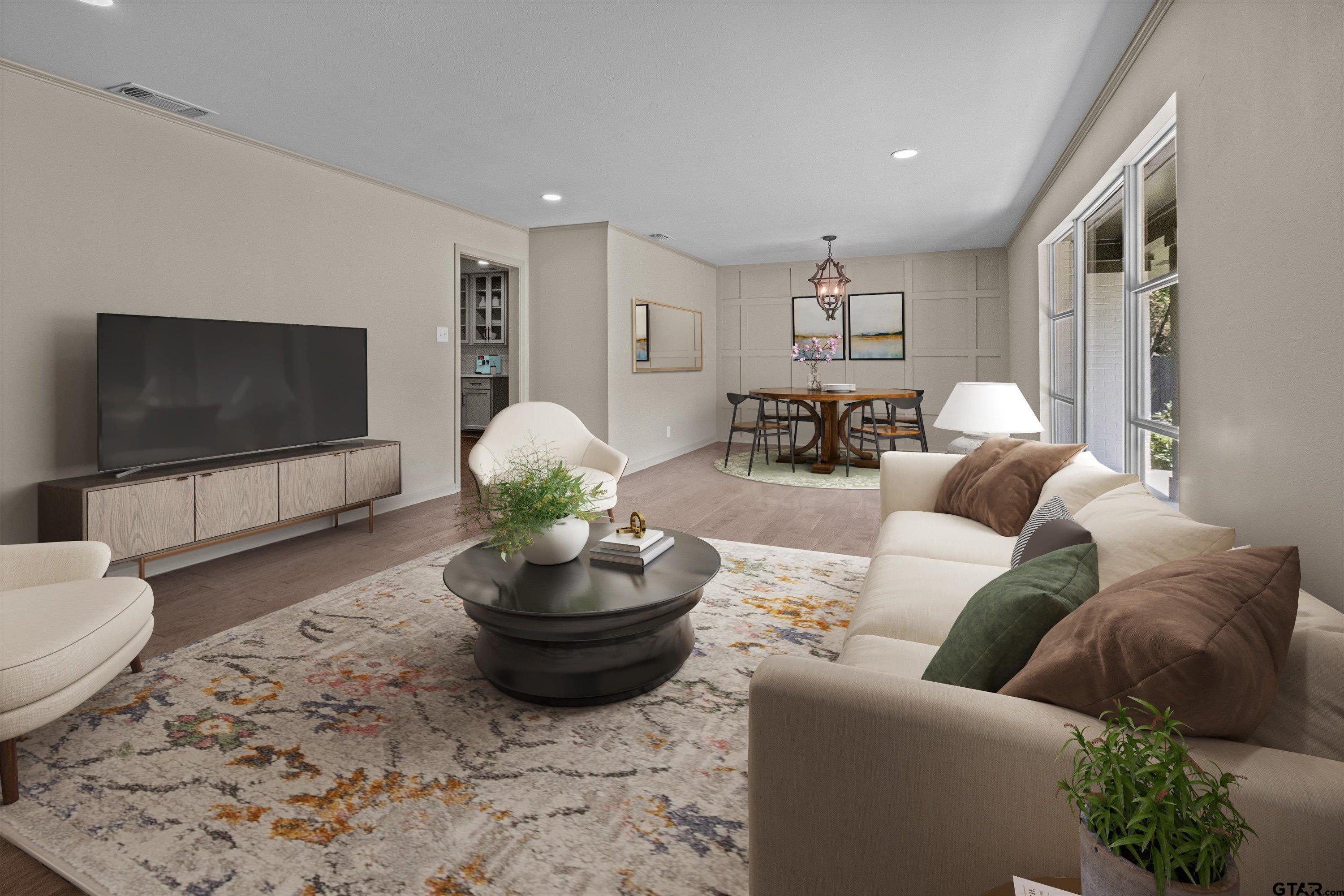 2515 Preston Avenue Tyler, TX 75701 - Photo 21 of 27 a living room with furniture and a flat screen tv