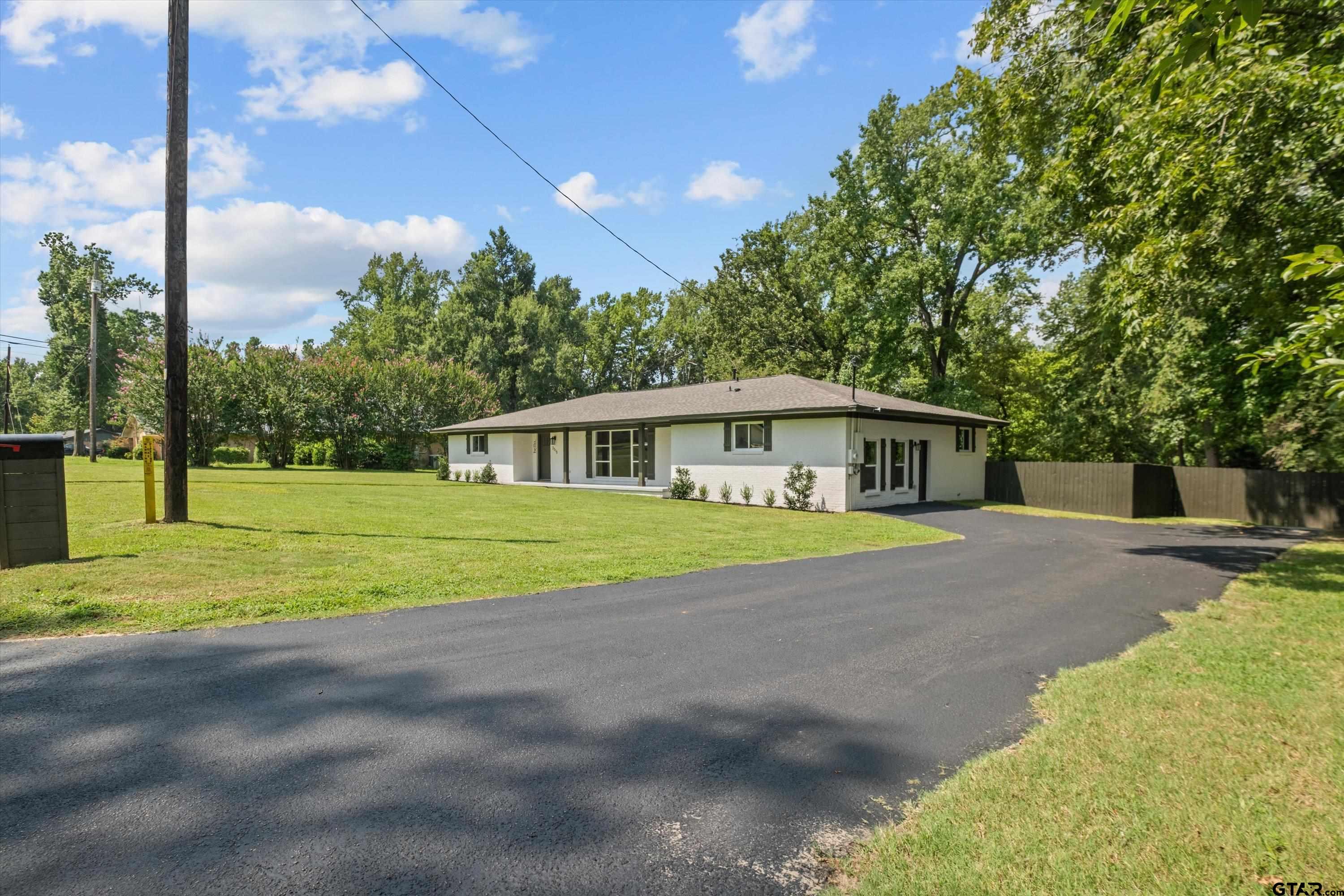 2515 Preston Avenue Tyler, TX 75701 - Photo 23 of 27 a front view of a house with a yard