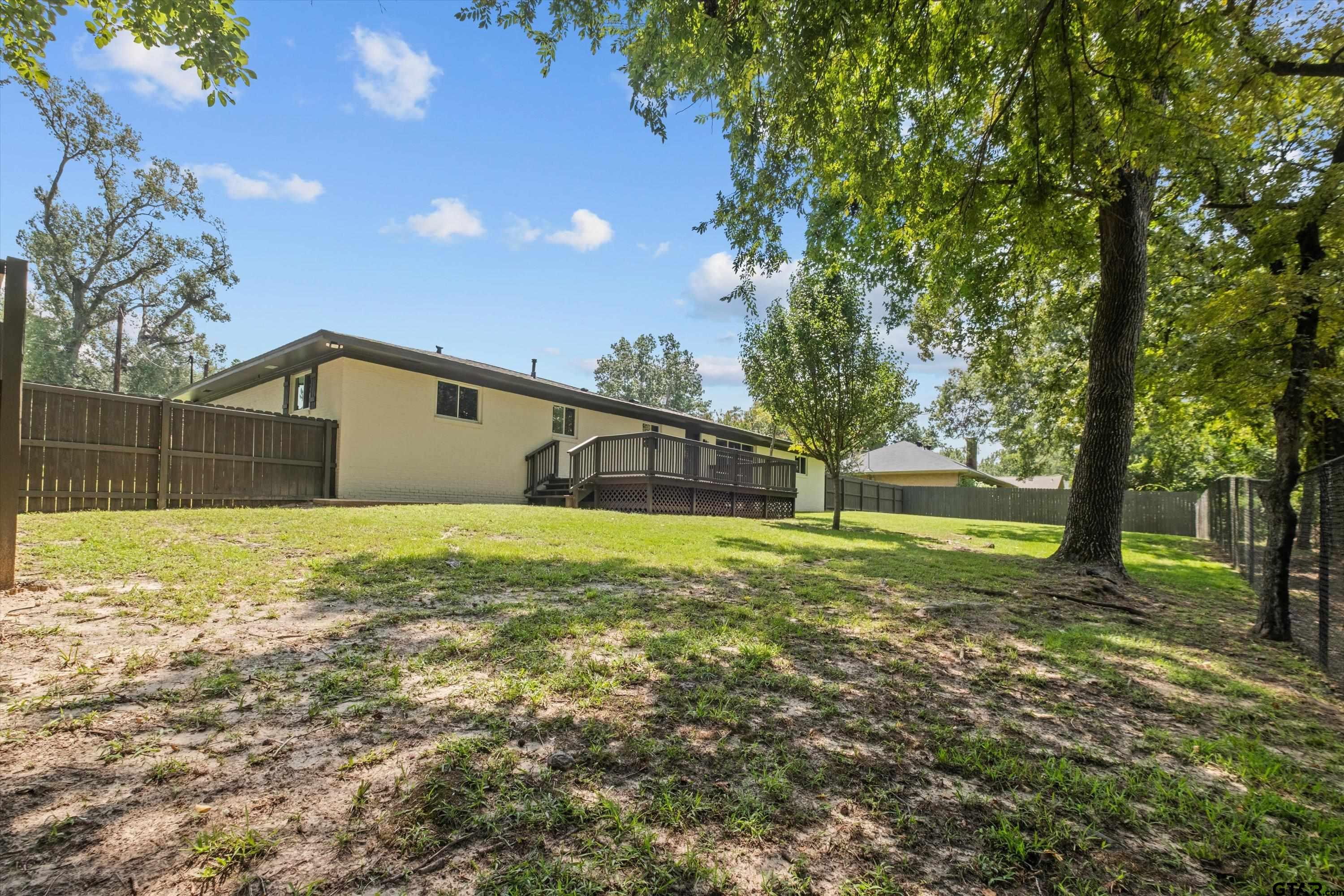 2515 Preston Avenue Tyler, TX 75701 - Photo 25 of 27 a view of a house with a yard