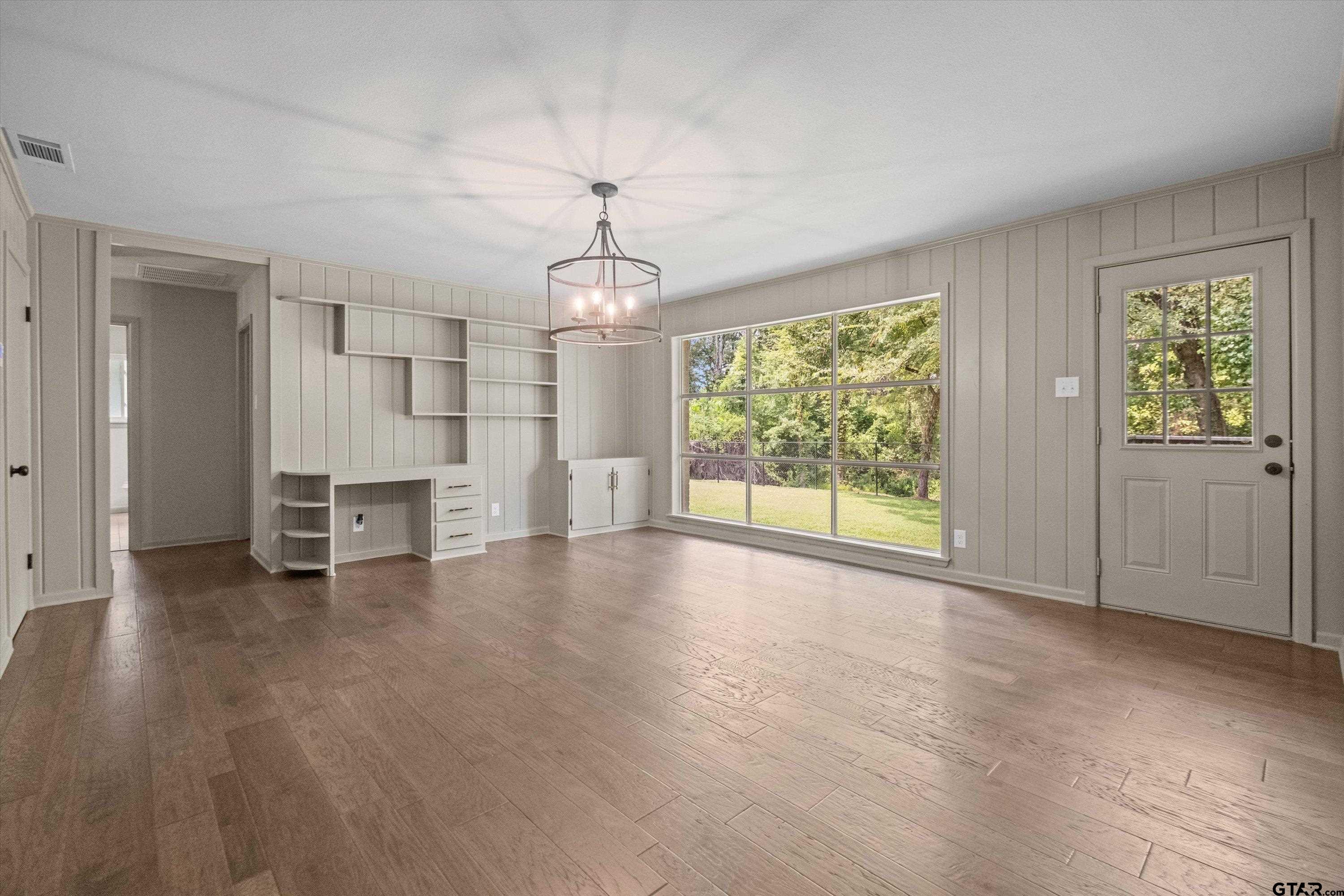 2515 Preston Avenue Tyler, TX 75701 - Photo 8 of 27 a view of empty room with wooden floor and fan