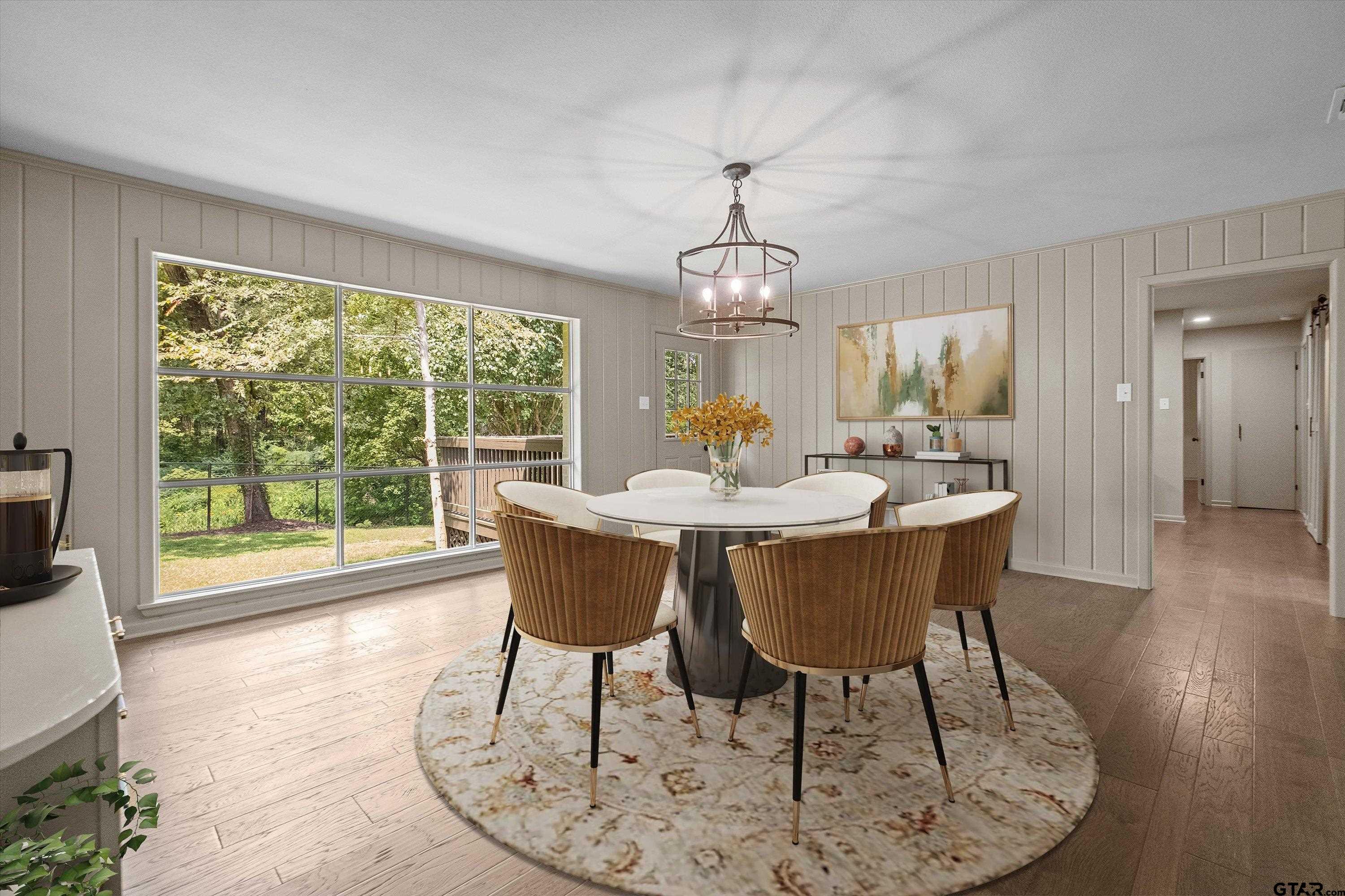 2515 Preston Avenue Tyler, TX 75701 - Photo 10 of 27 a view of a dining room with furniture wooden floor and chandelier