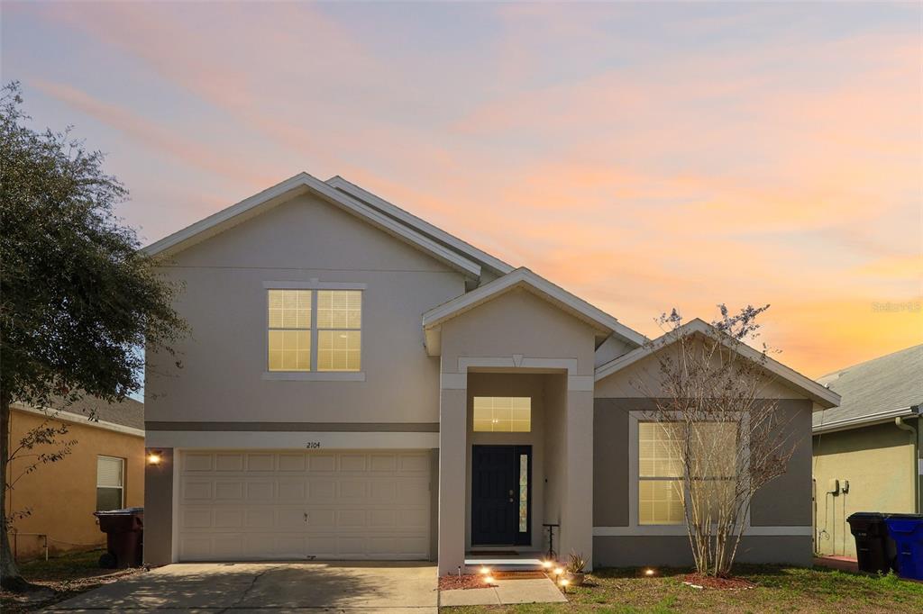 a front view of a house with a garage
