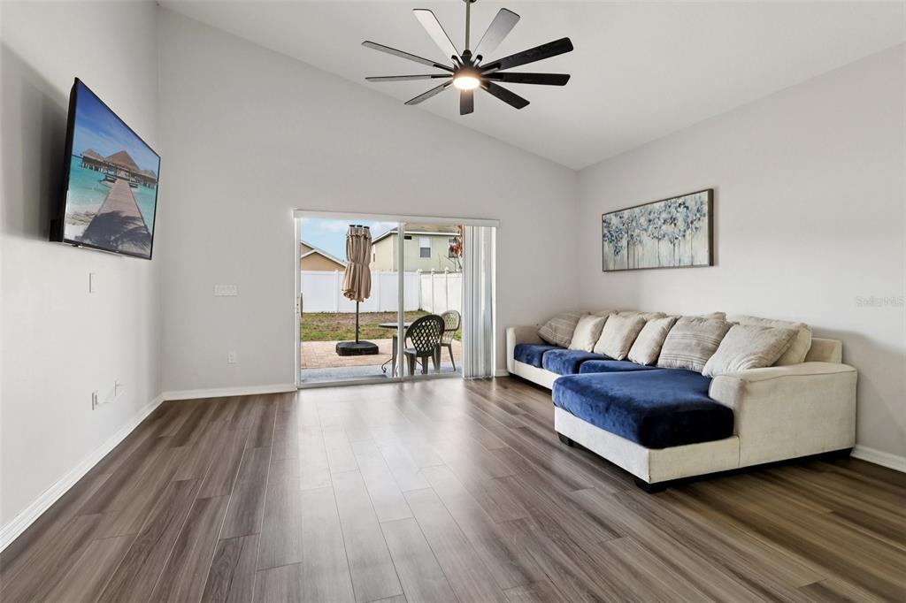 2104 Congress Lane St. Cloud, FL 34769 - Photo 14 of 71 a living room with furniture and a wooden floor