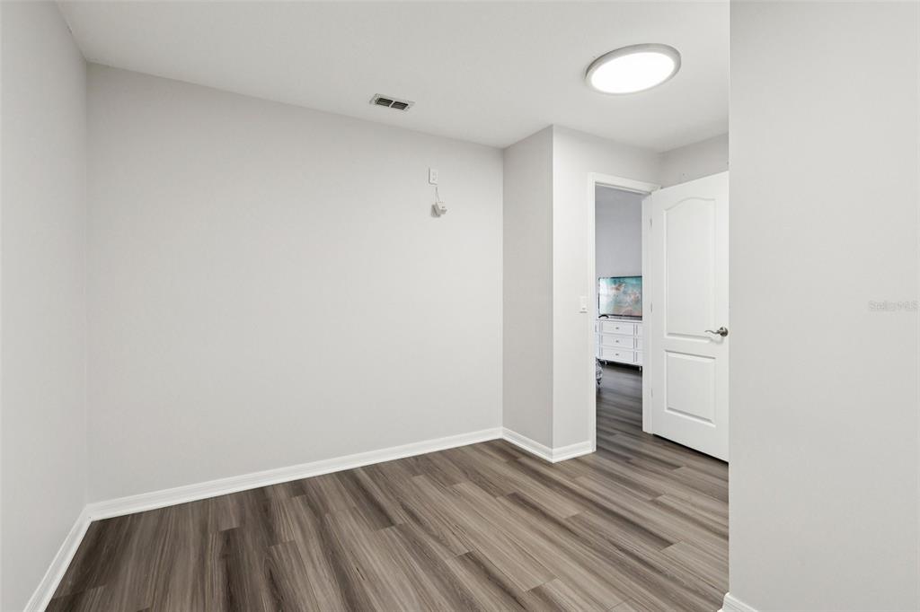 2104 Congress Lane St. Cloud, FL 34769 - Photo 23 of 71 a view of empty room with wooden floor