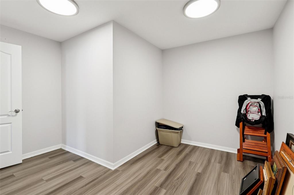 2104 Congress Lane St. Cloud, FL 34769 - Photo 25 of 71 a view of a room with wooden floor and bathroom