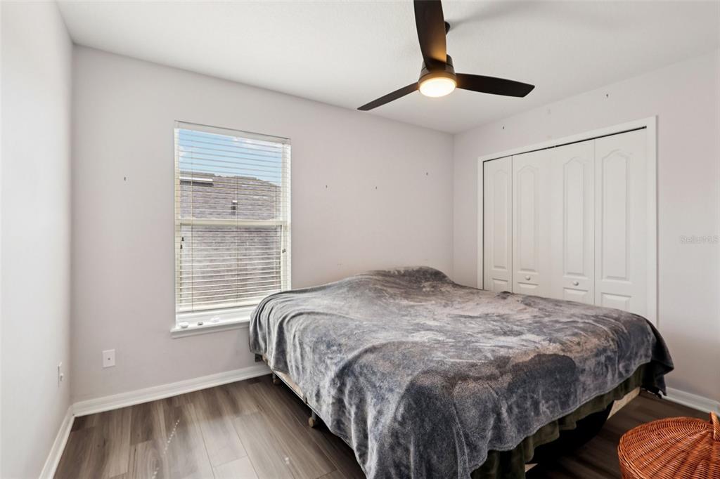 2104 Congress Lane St. Cloud, FL 34769 - Photo 29 of 71 a bedroom with a bed and a window