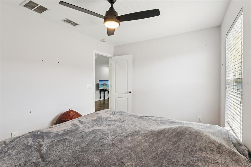 2104 Congress Lane St. Cloud, FL 34769 - Photo 30 of 71 a bedroom with a bed and a window