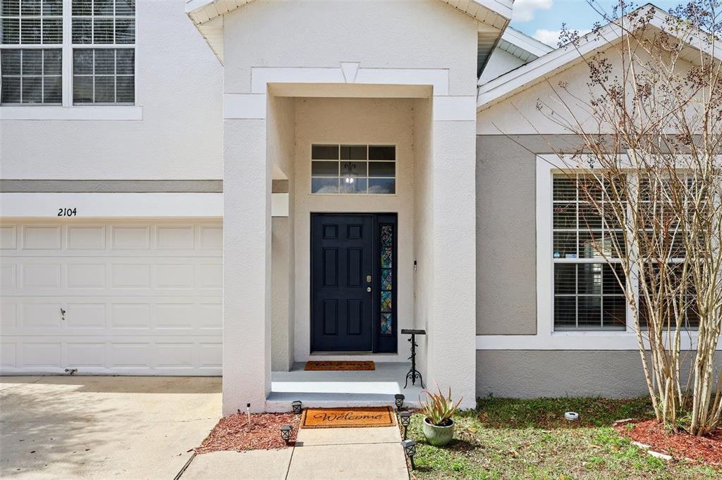 2104 Congress Lane St. Cloud, FL 34769 - Photo 3 of 71 a front view of a house with a yard