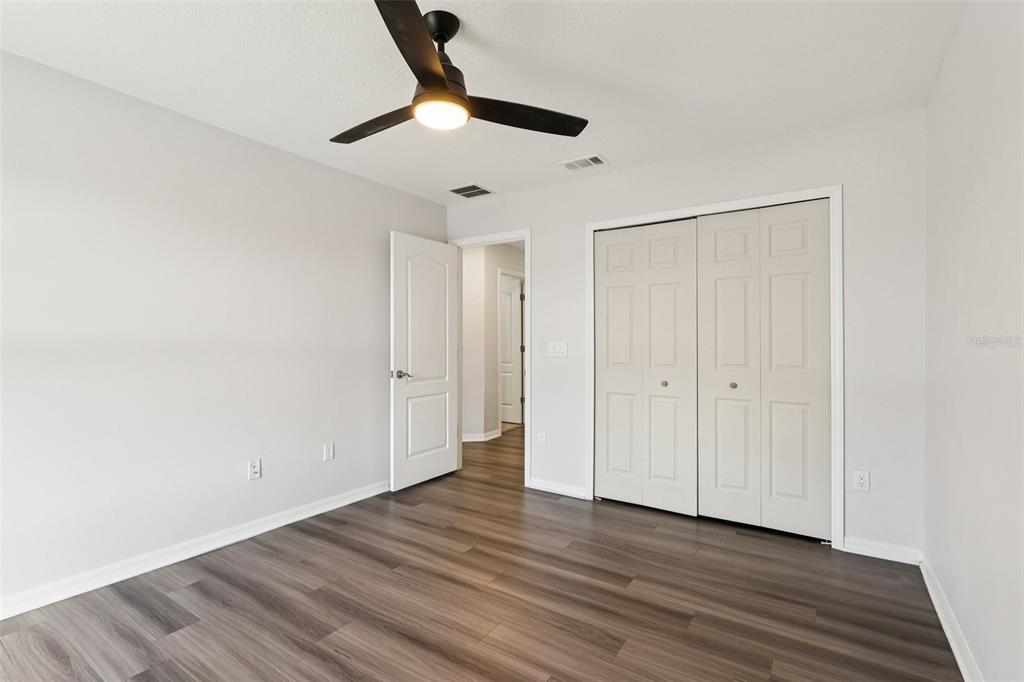 2104 Congress Lane St. Cloud, FL 34769 - Photo 32 of 71 a view of empty room with wooden floor