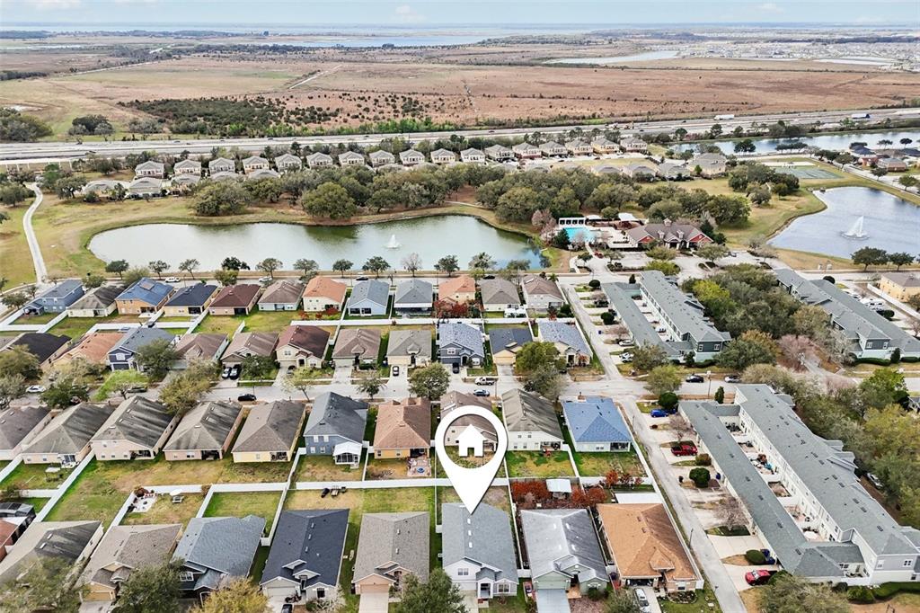 2104 Congress Lane St. Cloud, FL 34769 - Photo 45 of 71 an aerial view of a city with lots of residential buildings ocean and mountain view in back