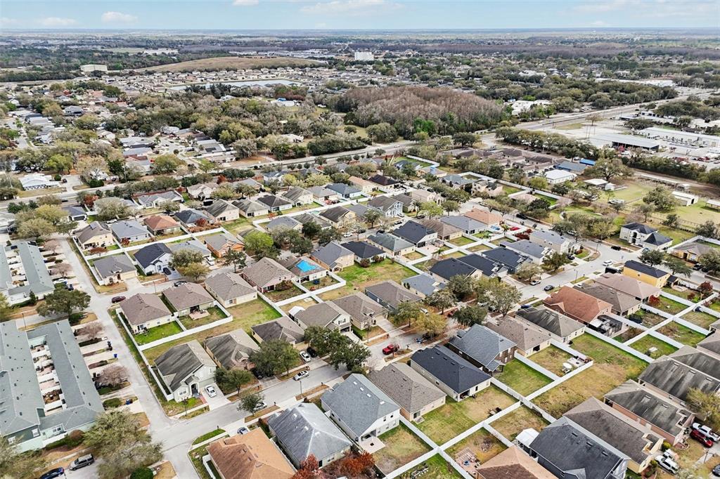 2104 Congress Lane St. Cloud, FL 34769 - Photo 47 of 71 an aerial view of residential building with parking