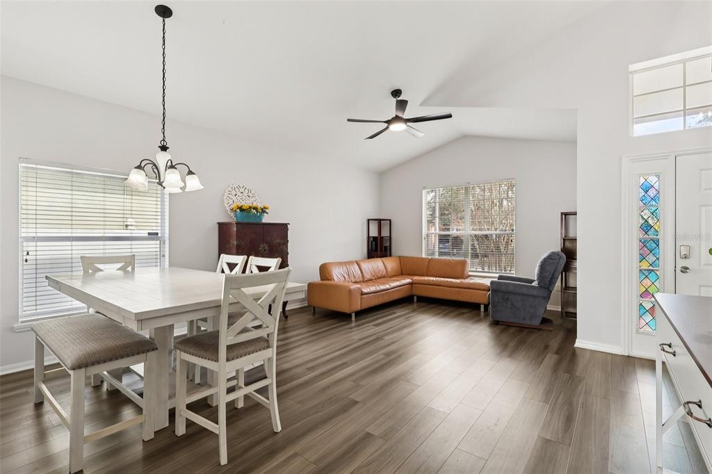 2104 Congress Lane St. Cloud, FL 34769 - Photo 6 of 71 a living room with furniture and a chandelier