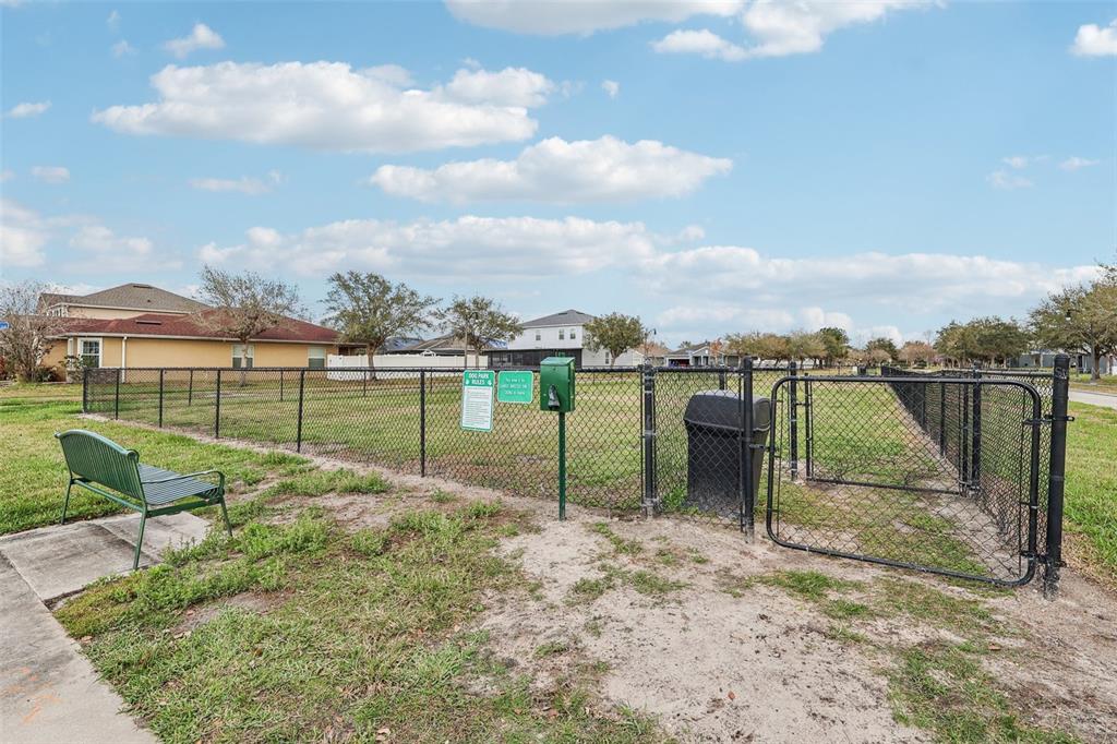 2104 Congress Lane St. Cloud, FL 34769 - Photo 69 of 71 a view of a park with swings on