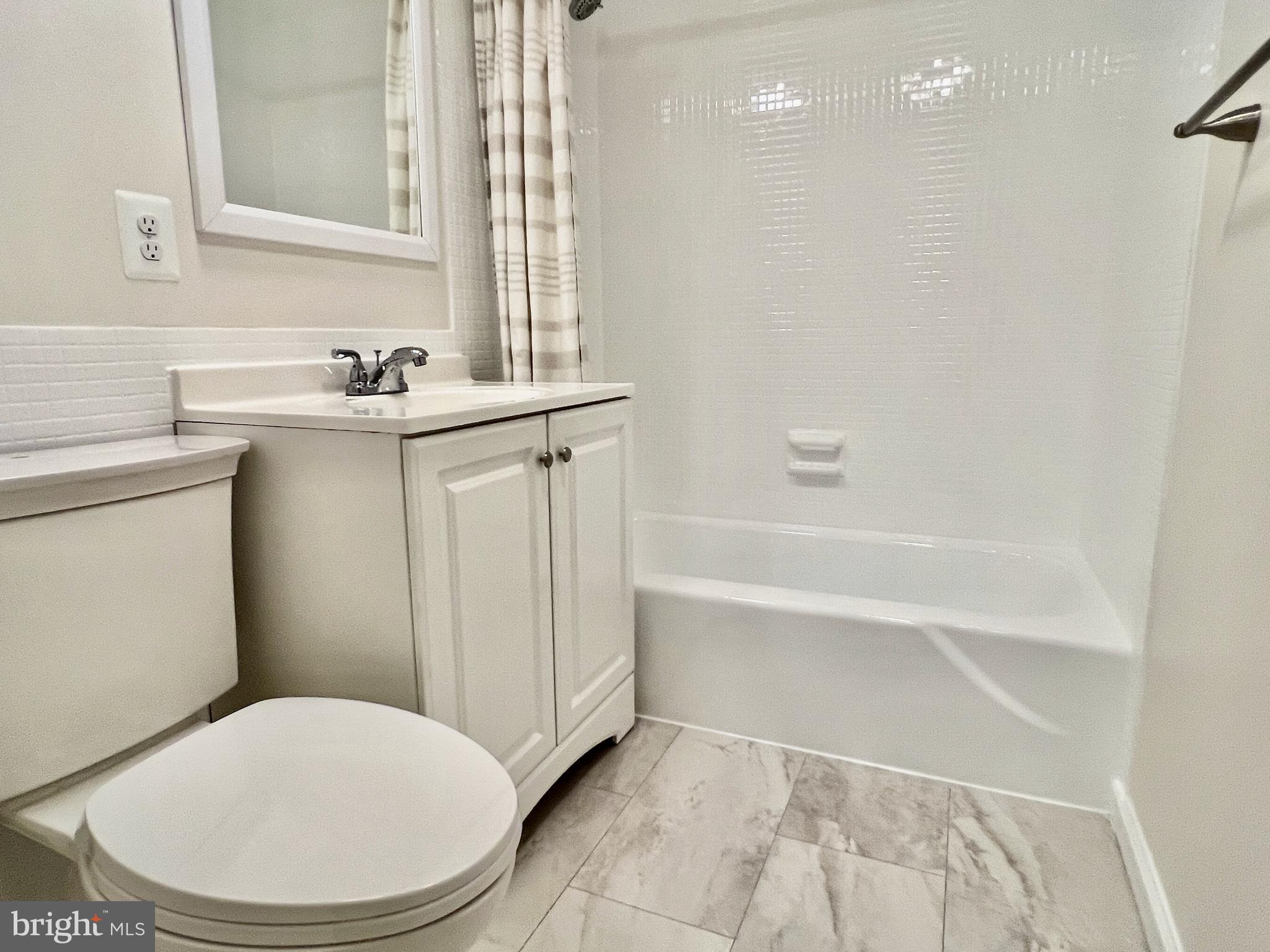 430 M Street Southwest, Unit N203 Washington, DC 20024 - Photo 5 of 5 a bathroom with a sink a toilet and shower