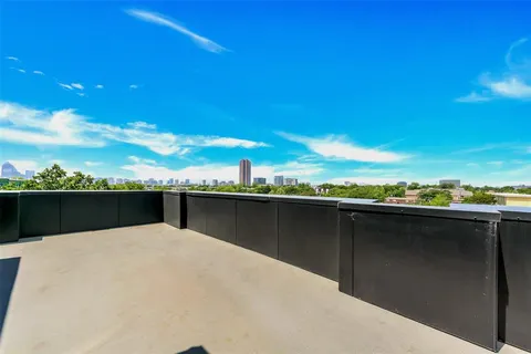 a view of balcony with furniture