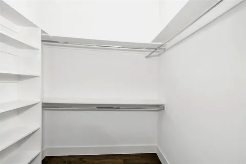 a bathroom with a double vanity sink mirror and shower