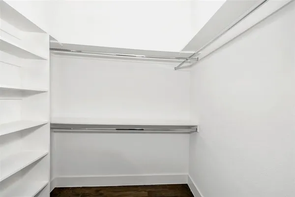 a bathroom with a double vanity sink mirror and shower
