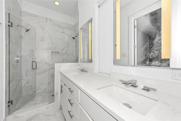 an empty room with a window and a ceiling fan