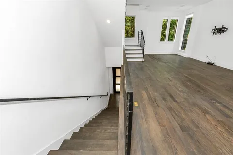 a view of an entryway with wooden floor