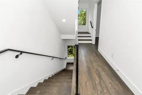 a view of a hallway with stairs
