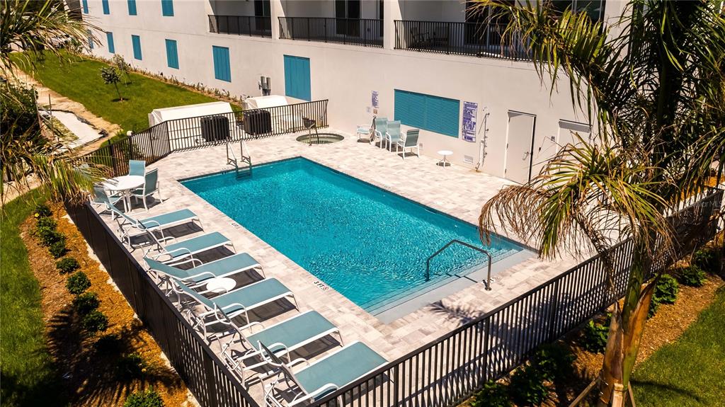 400 150th Avenue, Unit 504 Madeira Beach, FL 33708 - Photo 28 of 60 a view of a patio with swimming pool