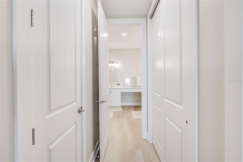 400 150th Avenue, Unit 504 Madeira Beach, FL 33708 - Photo 38 of 60 a view of a bathroom with a glass door