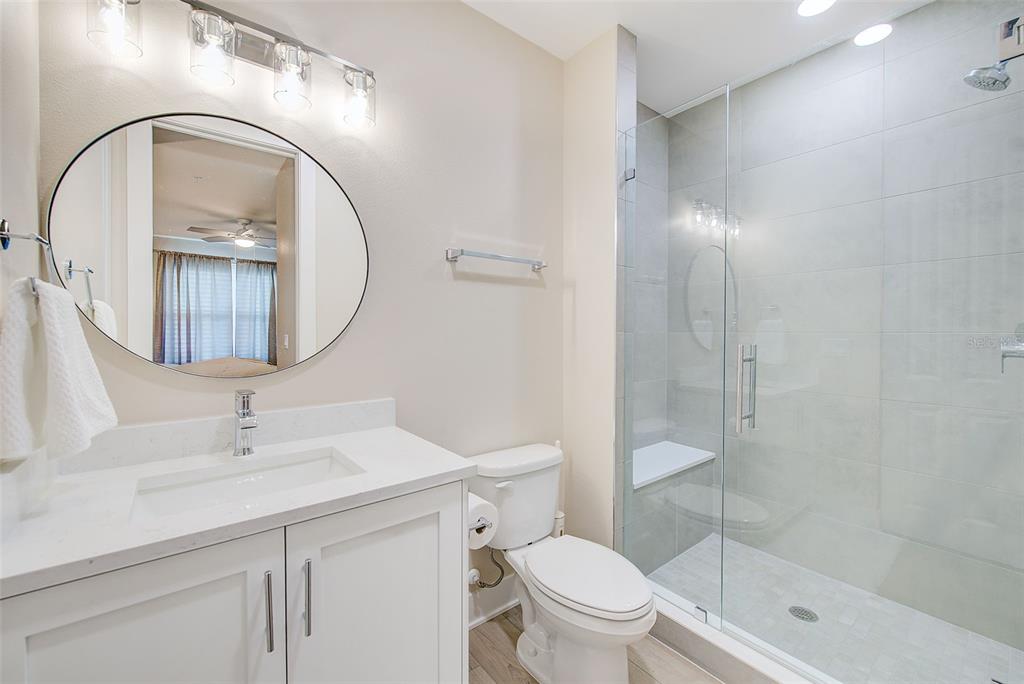 400 150th Avenue, Unit 504 Madeira Beach, FL 33708 - Photo 42 of 60 a bathroom with a sink toilet and shower