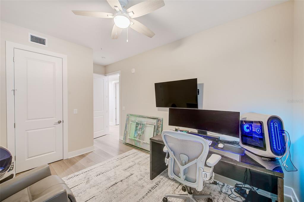 400 150th Avenue, Unit 504 Madeira Beach, FL 33708 - Photo 47 of 60 a view of a livingroom with workspace and a window