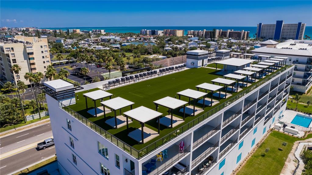 400 150th Avenue, Unit 504 Madeira Beach, FL 33708 - Photo 5 of 60 a view of a chairs and table in a terrace