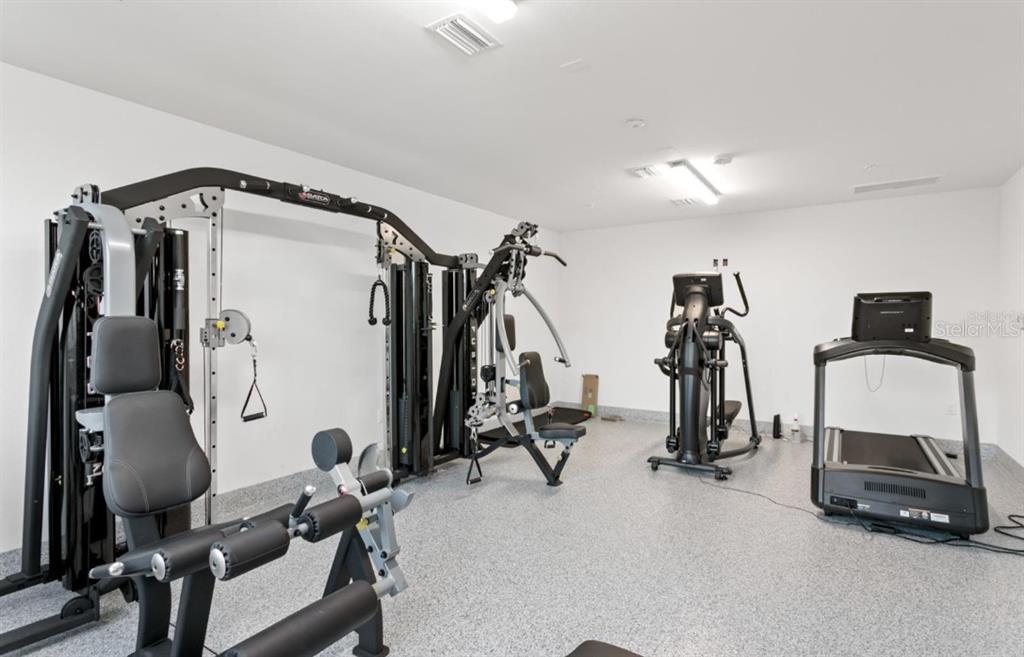 400 150th Avenue, Unit 504 Madeira Beach, FL 33708 - Photo 52 of 60 a view of a room with gym equipment