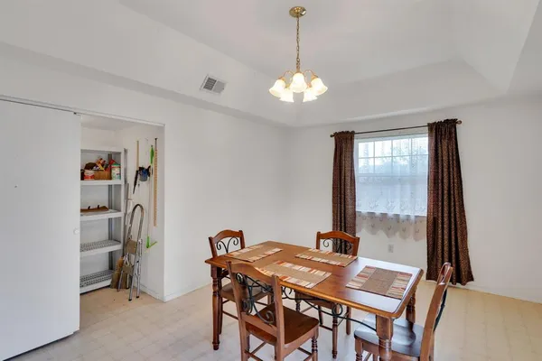 a view of a dining room with furniture window and outside view