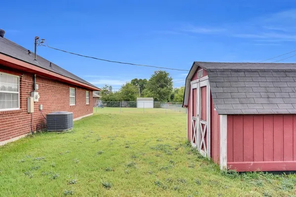 a backyard of a house with lots of green space