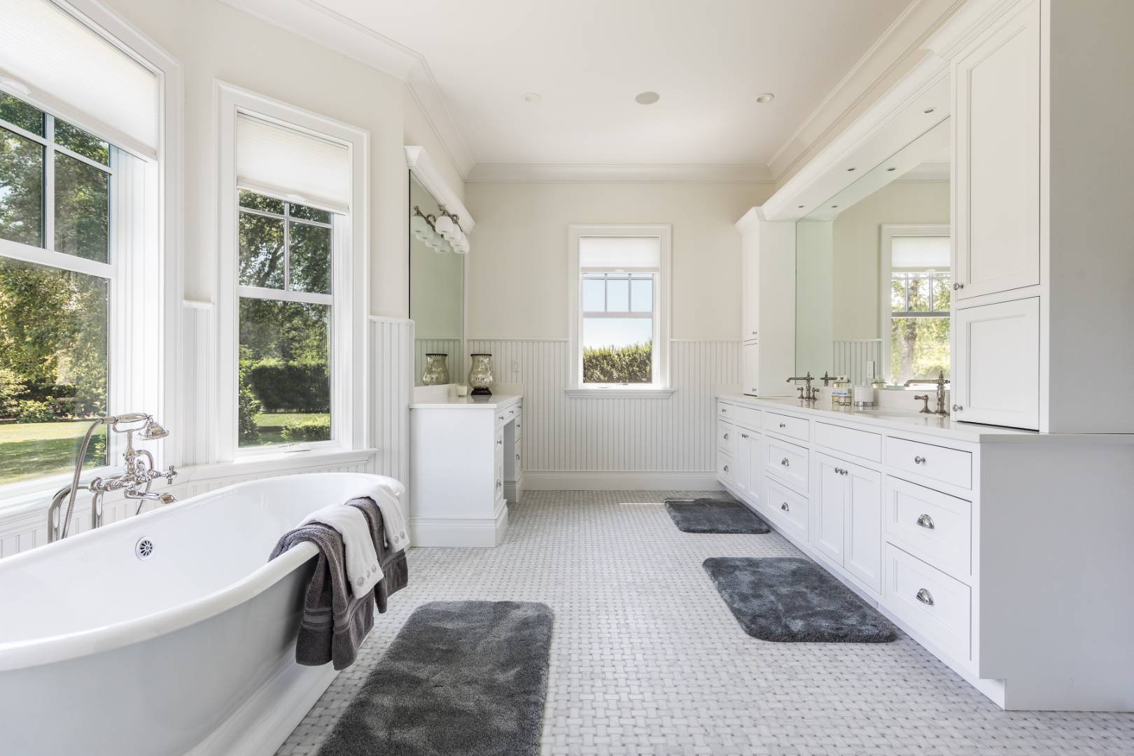 170 Scuttle Hole Road Water Mill, NY 11976 - Photo 13 of 33 a bathroom with a tub sink a window and mirror