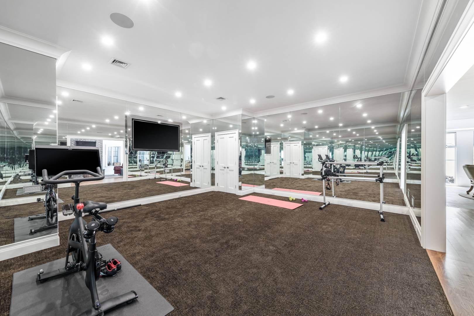 170 Scuttle Hole Road Water Mill, NY 11976 - Photo 23 of 33 a view of a room with gym equipment and a fireplace