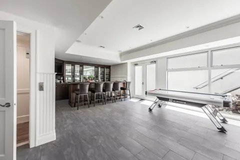 a view of a livingroom with furniture and hardwood floor