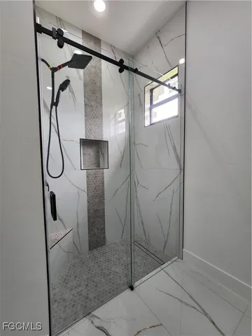 a kitchen with a refrigerator and cabinets