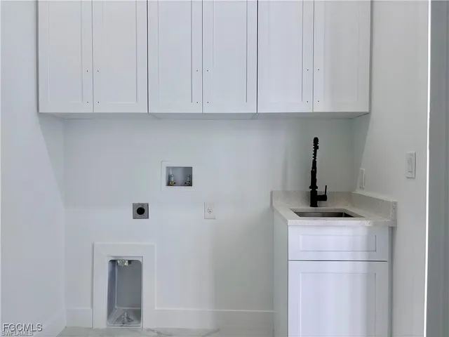 a kitchen with a sink and cabinets