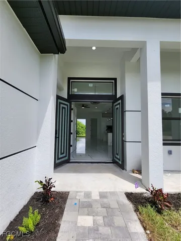 a view of a hallway with a chandelier